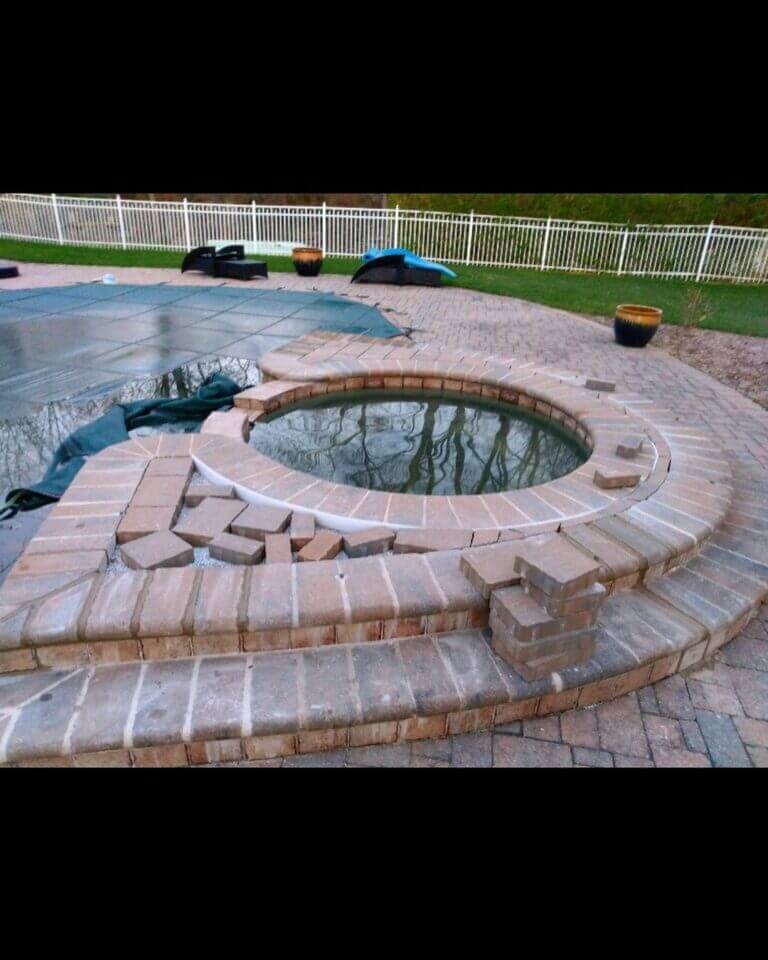 Curved stone steps and round patio seen from above